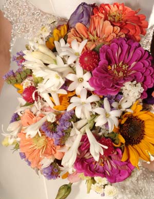 Darci's bouquet includes lisianthus, zinnias, gomphena, tuberoses, statice, feverfew and sunflowers, all freshly plucked from nearby Pendleton Farms.